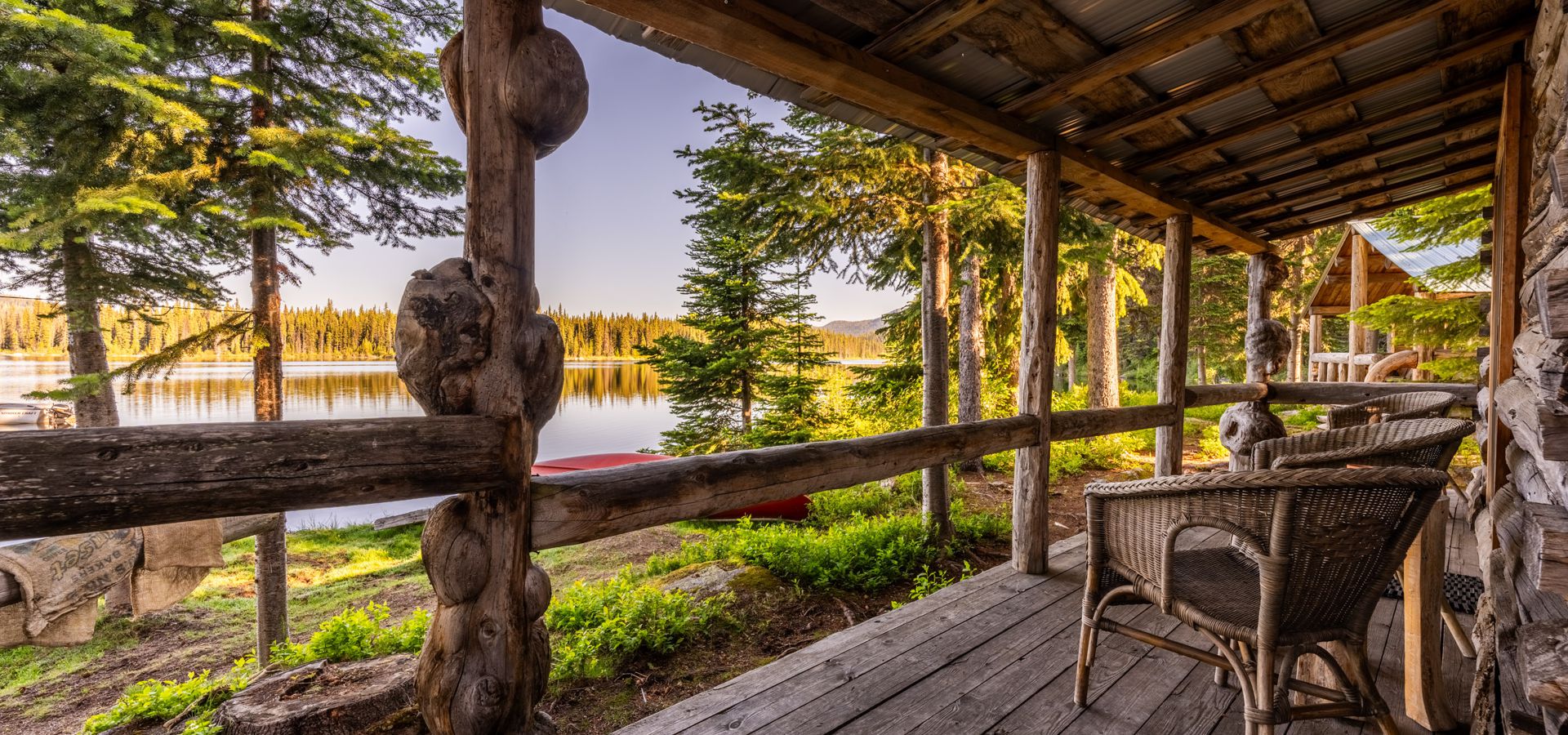 Photo pf a peaceful veranda on one of the Caverhill Lodge cabins, looking at the lake